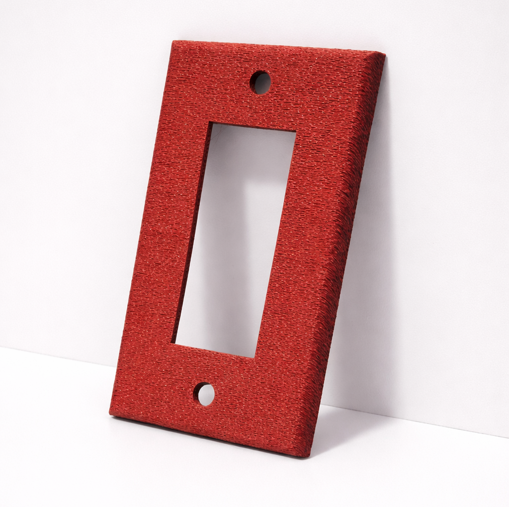 Plaque d'interrupteur avec un fini ondulé